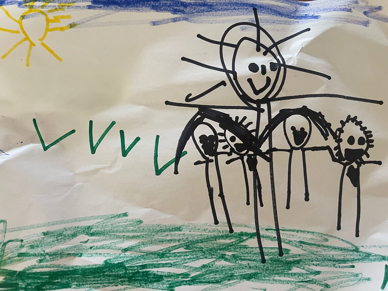 child's drawing of the whole family including summer